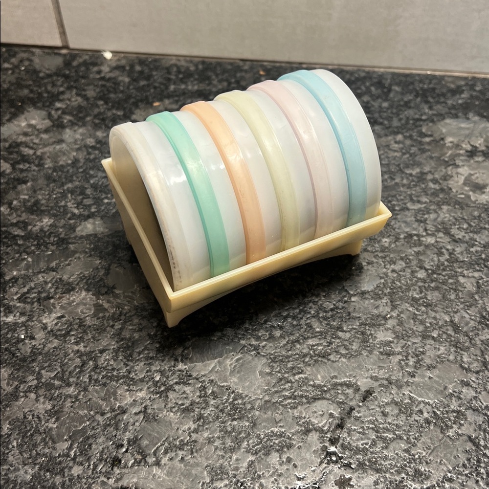 Vintage Tupperware Canister set in holder.  Set of 6. I think NWOT.